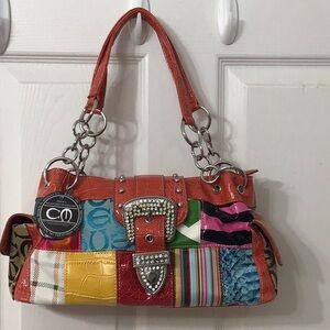 Registered CM trademark purse similar to Coach design. Very colorful.